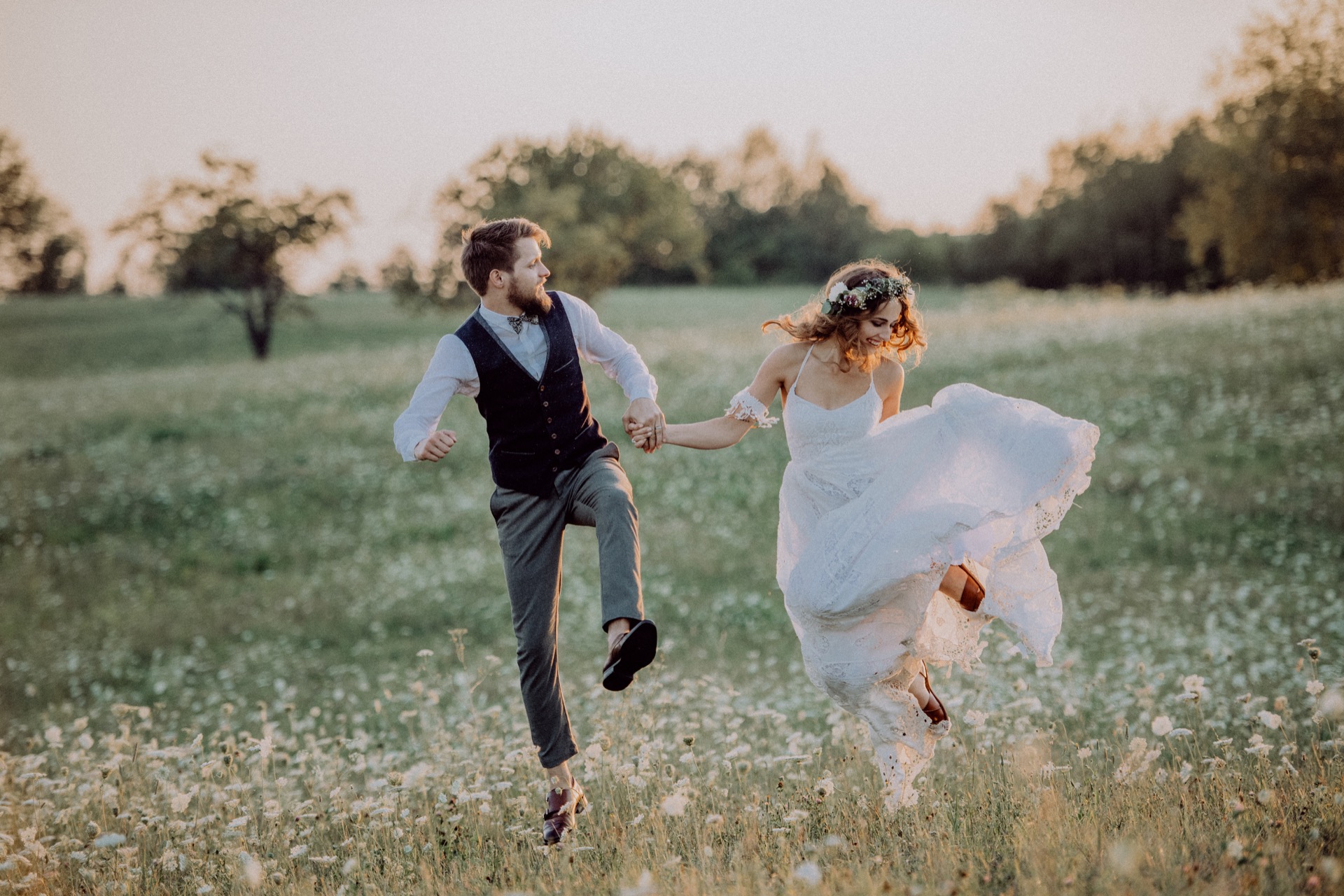 beautiful-bride-and-groom-at-sunset-in-green-natur-PS3WDVS.jpg