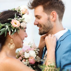 young-couple-in-a-wedding-ceremony-at-the-beach-MPTK5HL-scaled-1.jpg